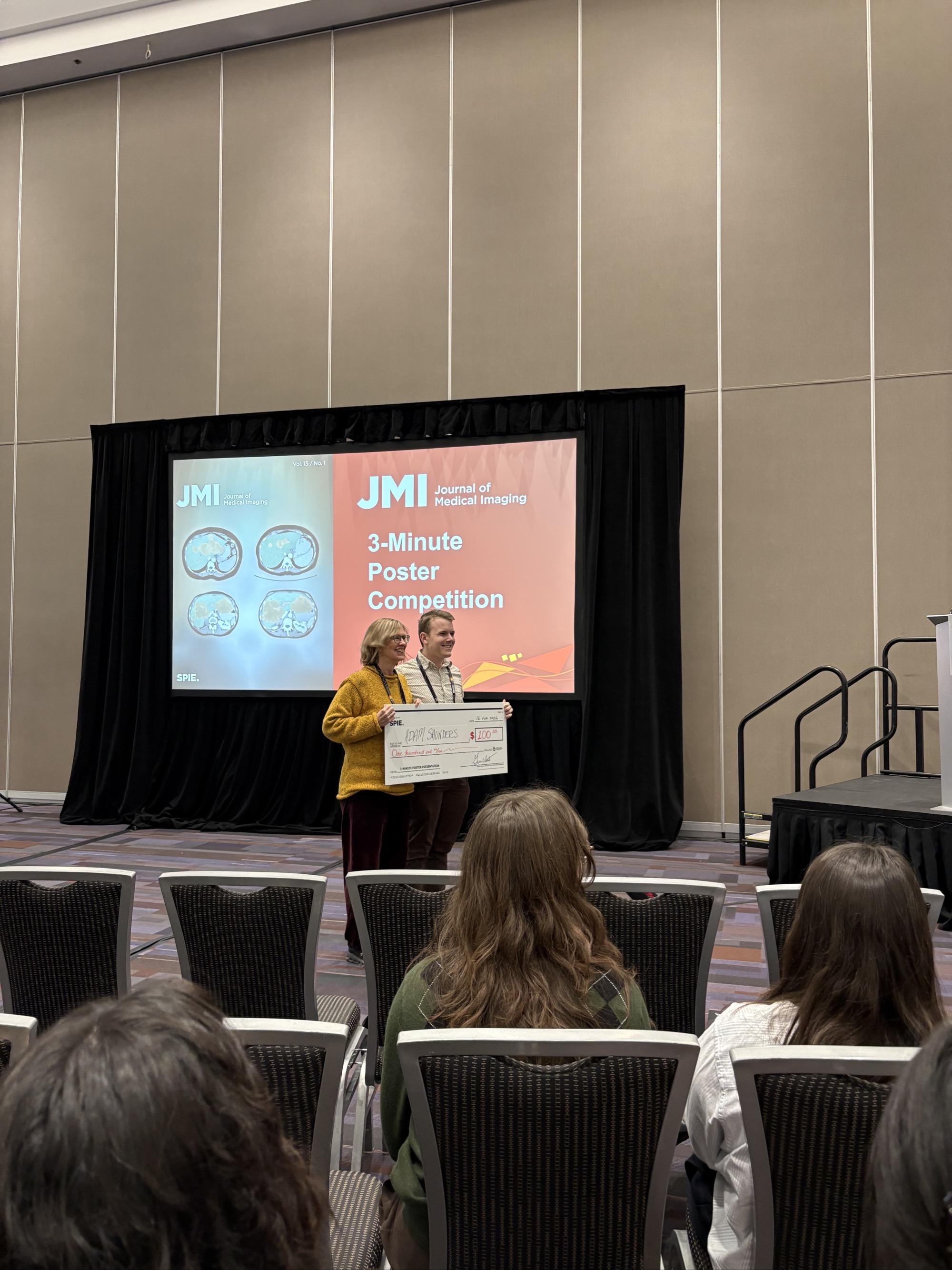 Me posing with a comically large check for 3rd place at the JMI 3-Minute Poster Competition